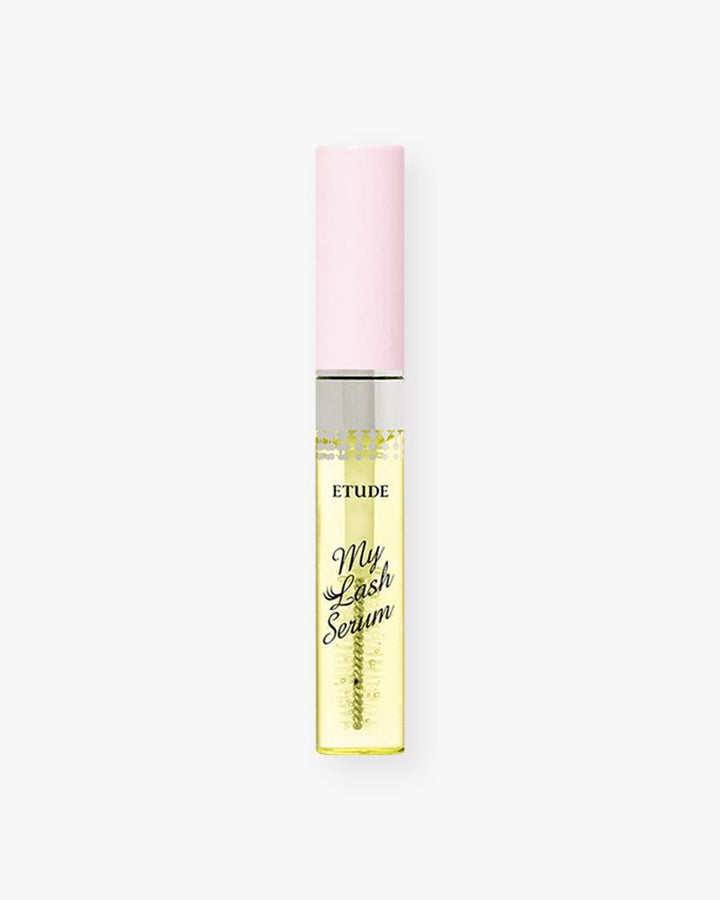 Eyelash serum bottle with pink cap and yellow label on a white background